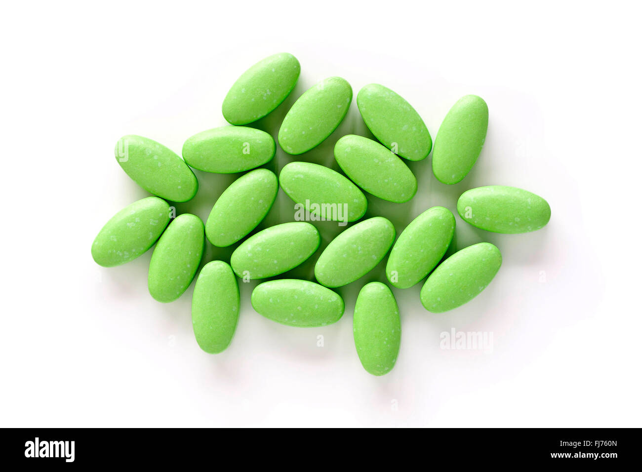 A pile of vitamin B supplement tablets isolated on a white background from above. Stock Photo