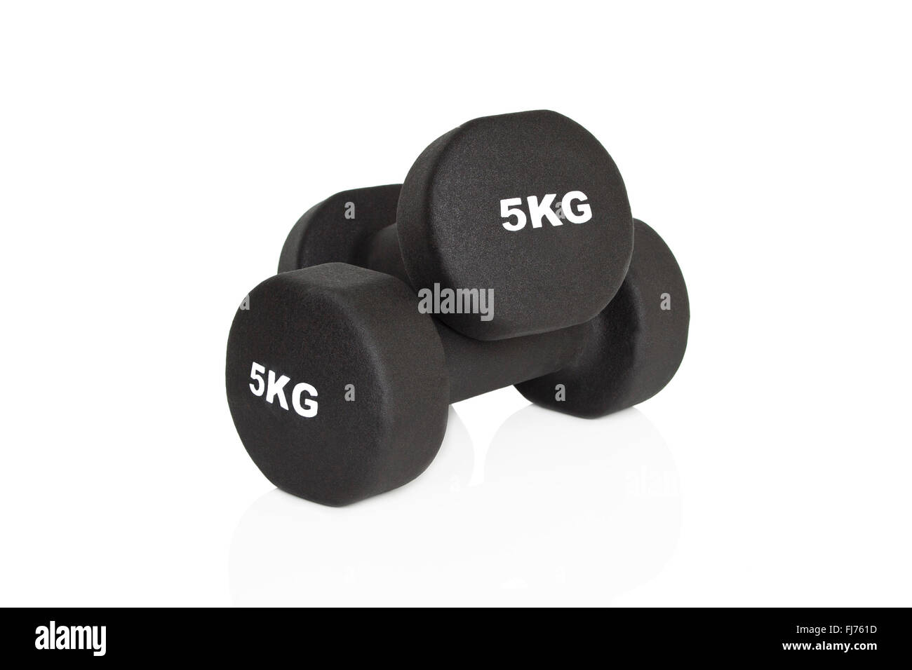 Black 5kg dumbbells isolated on white background. Weights for a fitness training. Stock Photo