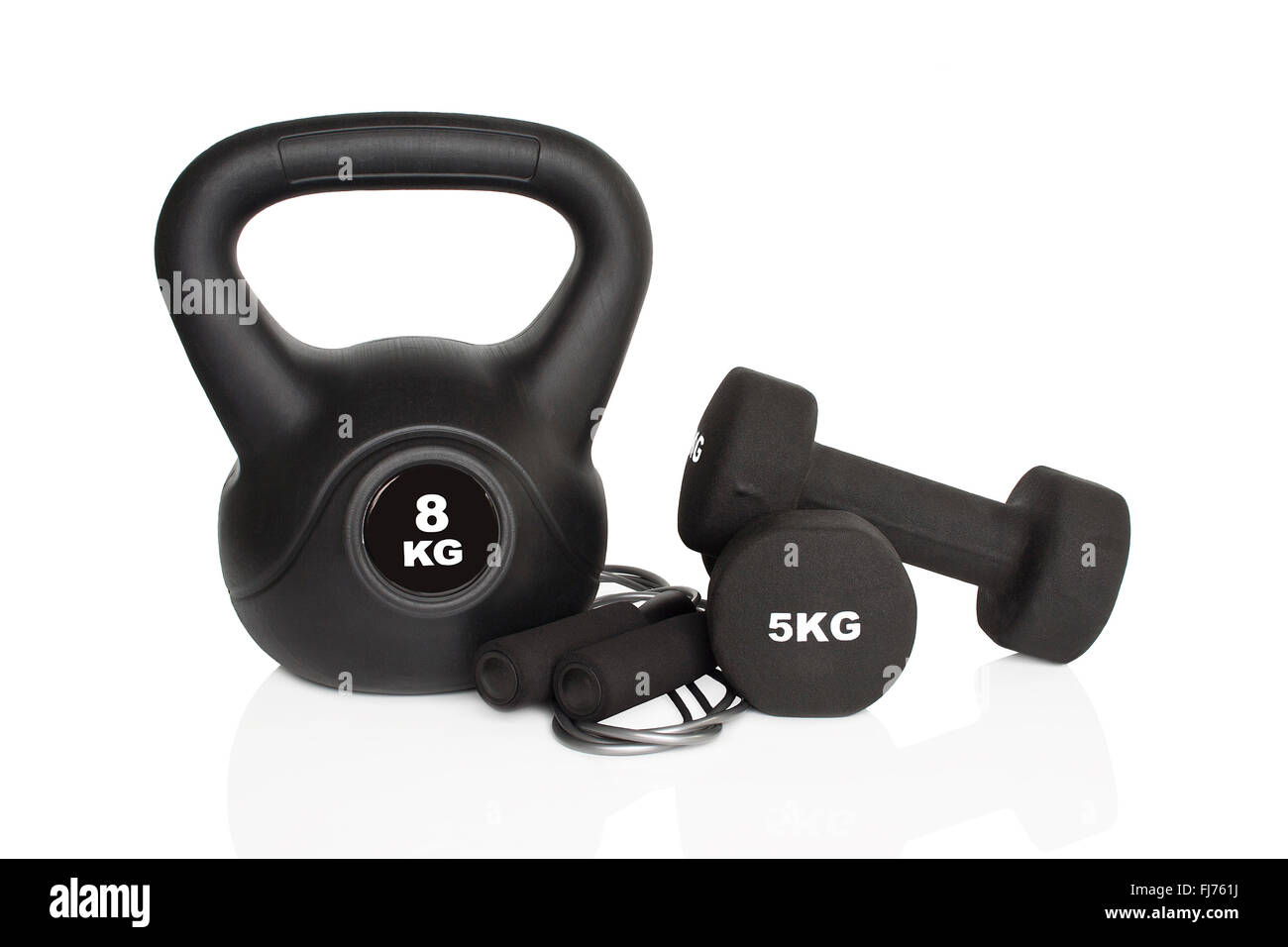 Black dumbbells and kettlebell isolated on white background. Weights for a fitness training. Stock Photo