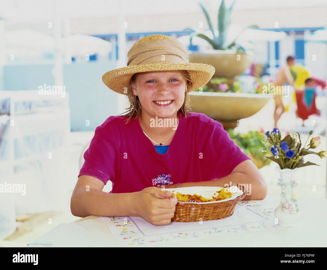 Young girl eating pasta in restaurant, Forte Dei Marmi, Province of Lucca, Tuscany Region, Italy Stock Photo