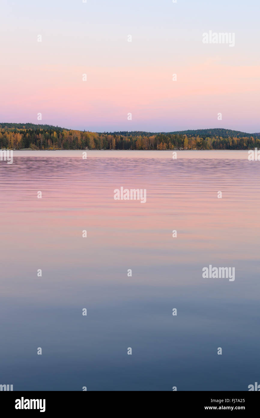 Serene lake scenery at dusk in Finland Stock Photo Alamy