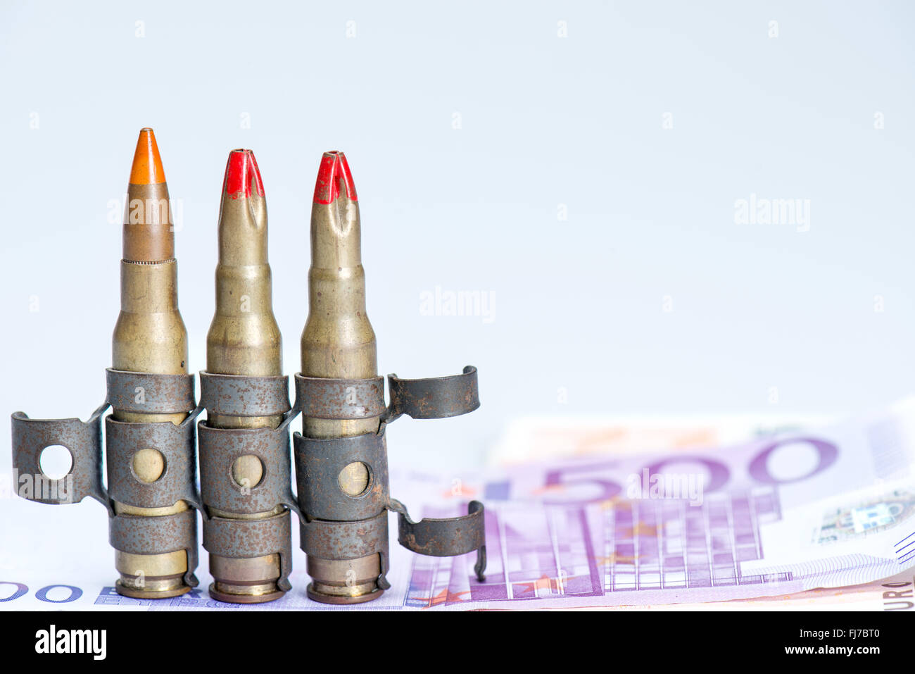 small vest rifle bullets with euro note Stock Photo