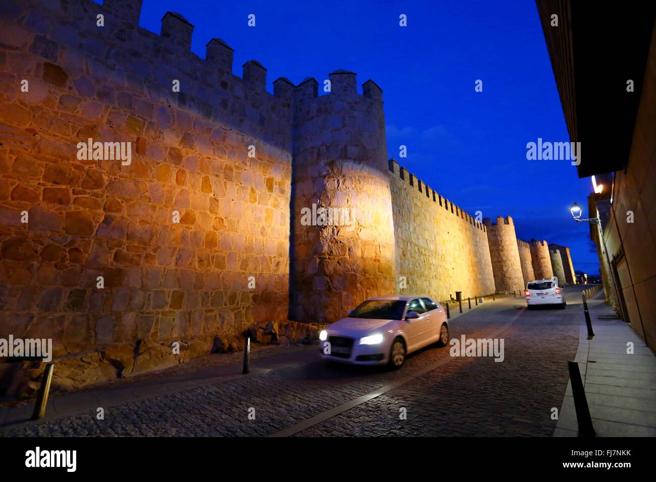 (160301) -- BRUSSELS, March 1, 2016 (Xinhua) -- Photo taken on Feb. 16, 2016 shows night view of the old town of Avila in Spain. The city of Avila is around 100 km to the north-west of Spain's capital city of Madrid. Founded in the 11th century to protect the Spanish territories from the Moors, this 'City of Saints and Stones', the old town of Avila has kept its medieval austerity. This purity of form can still be seen in the Gothic cathedral and the fortifications which, with their 82 semicircular towers and nine gates, are the most complete in Spain. The Old Town of Avila with its Extra-Muro Stock Photo