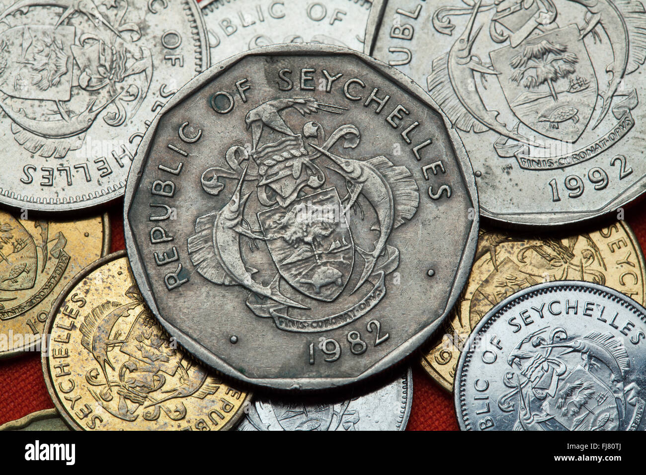 Coins of the Seychelles. Coat of arms of the Seychelles depicted in the Seychellois rupee coins. Stock Photo