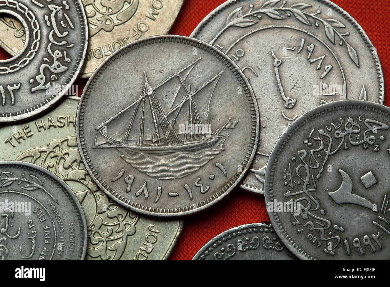 Coins of Kuwait. Traditional Kuwaiti sailing vessel (dhow) called boom depicted in the Kuwaiti 100 fils coin. Stock Photo