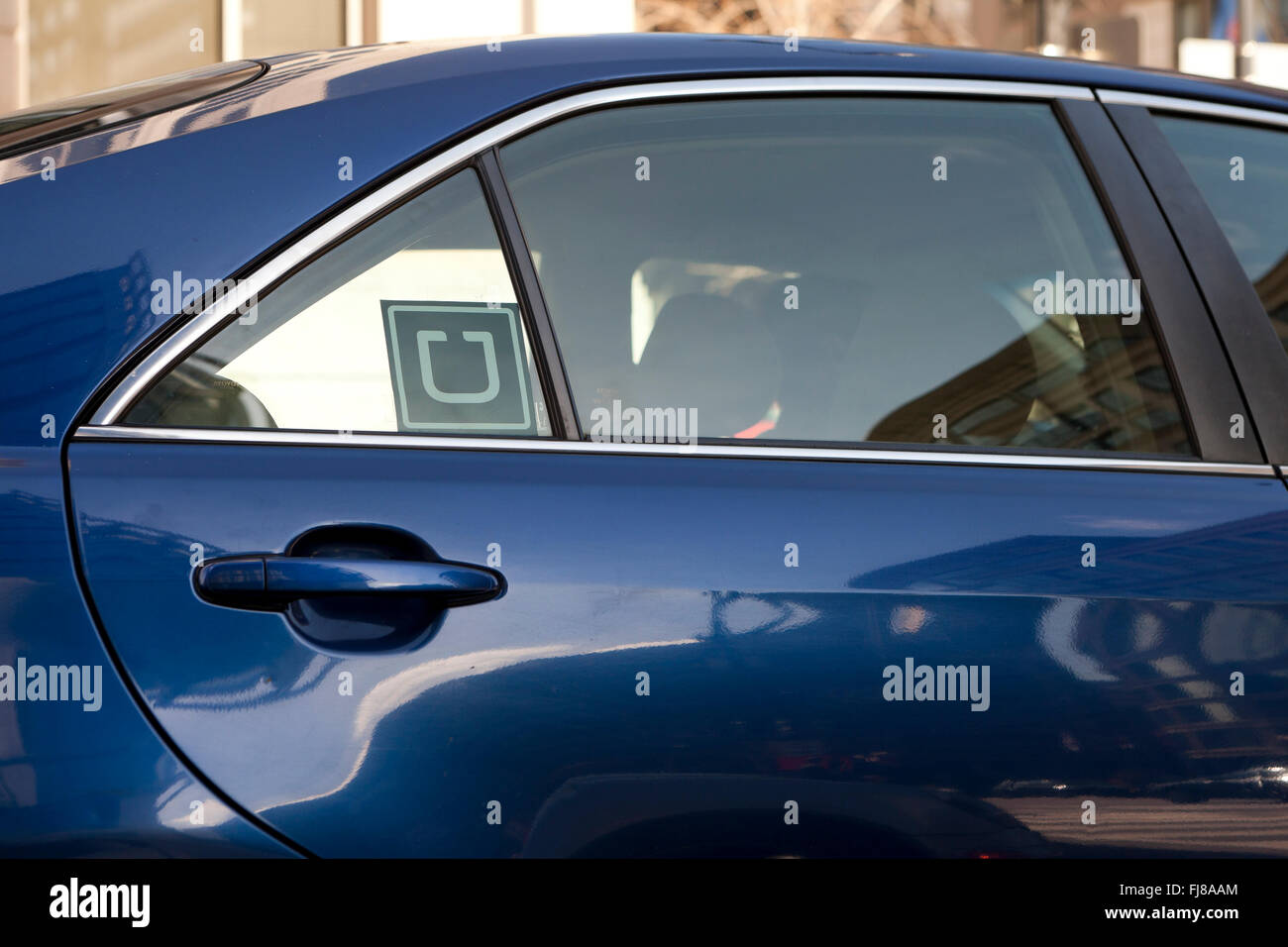 Uber sticker on car window - USA Stock Photo