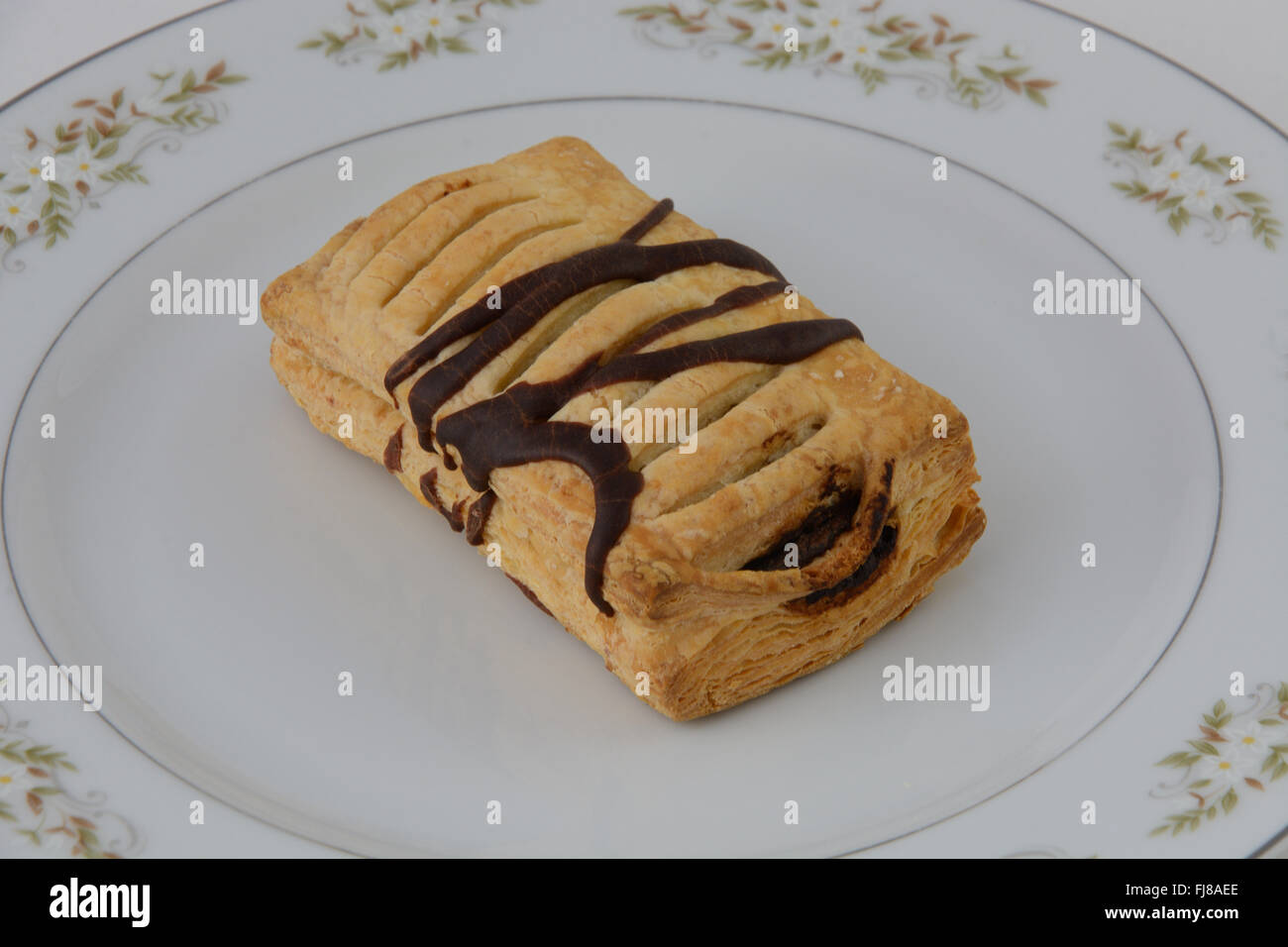Chocolate jalousie pastry on plate Stock Photo