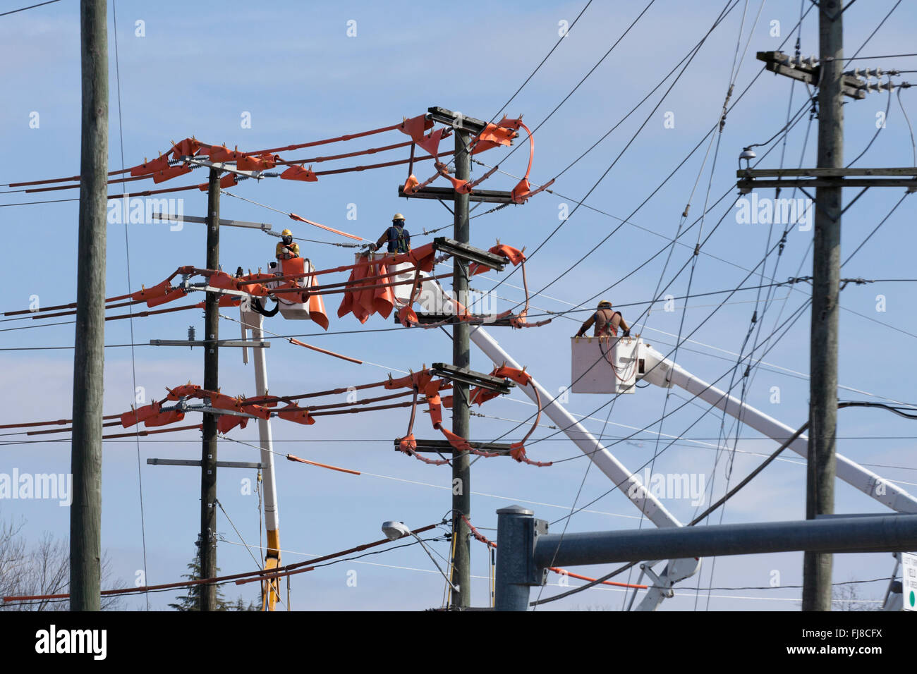 Linemen working on electric line - USA Stock Photo