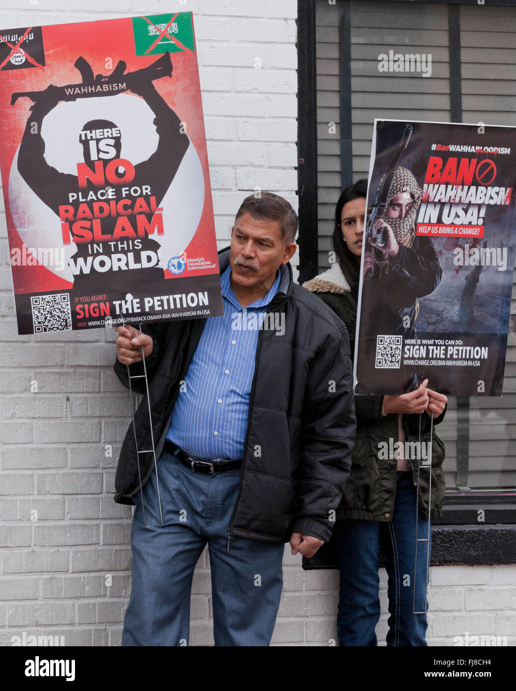 Members of Messiah Foundation International holding anti-Wahhabism signs - Washington, DC USA Stock Photo