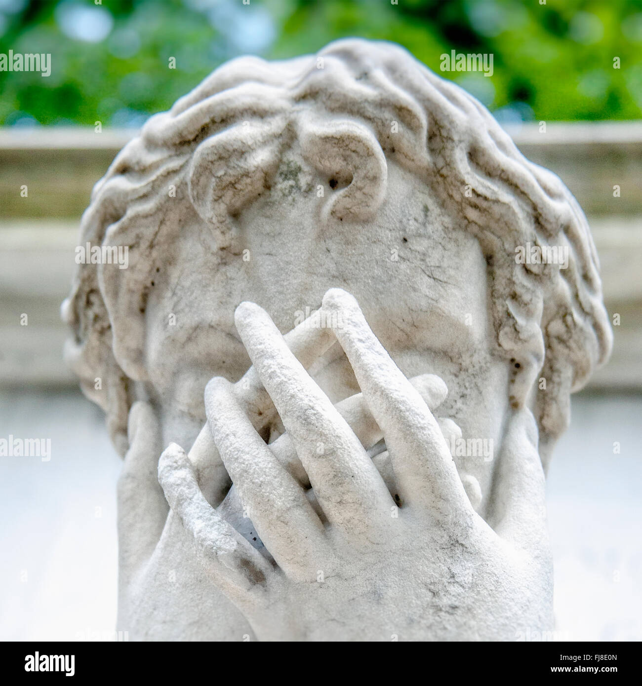 Statue covering face at Père Lachaise Cemetery in Paris,France Stock Photo