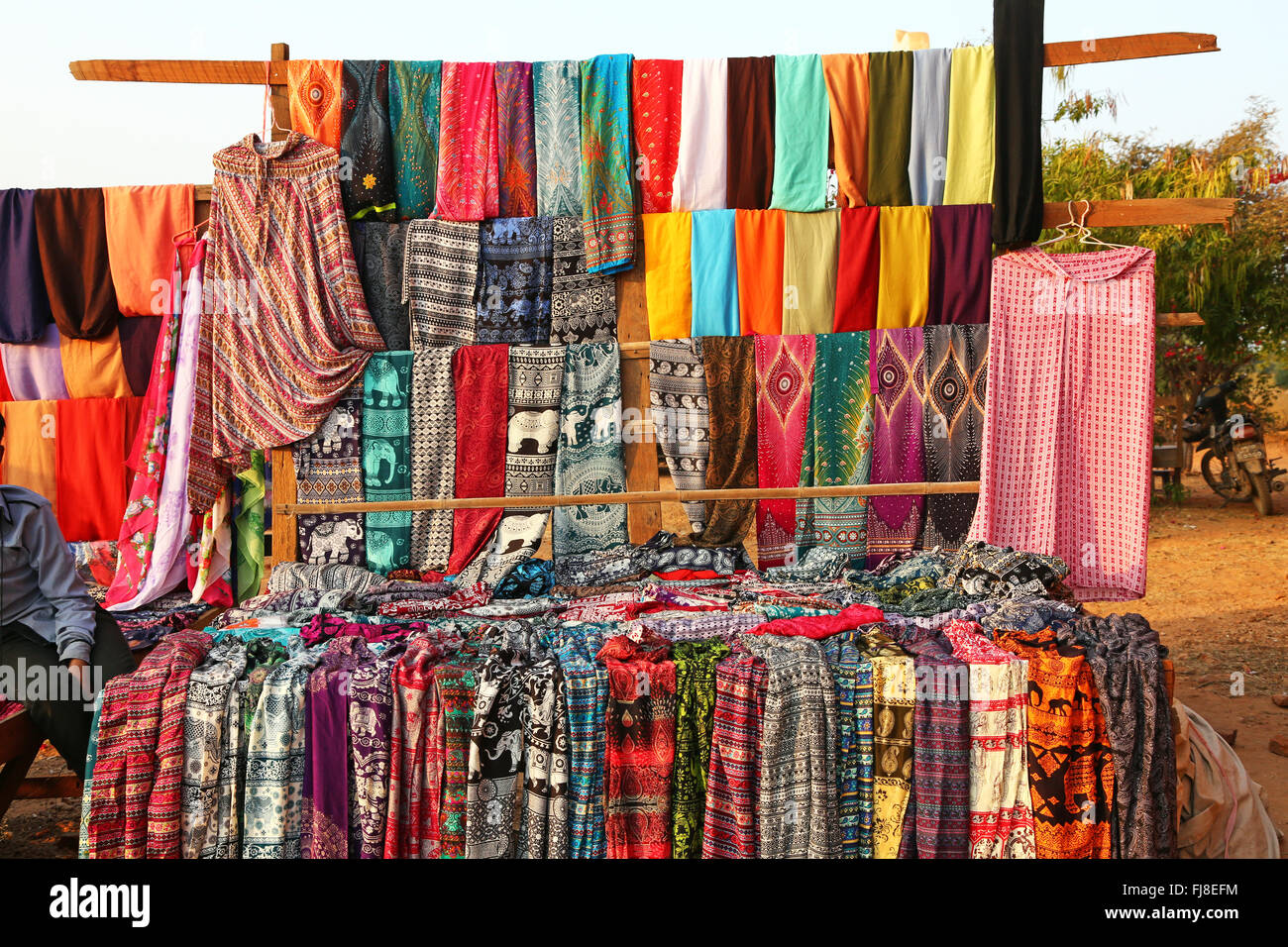 Trouser and clothing stall at Pyathadar Hpaya Temple Pagoda on the Plain of Bagan, Bagan, Myanmar (Burma) Stock Photo