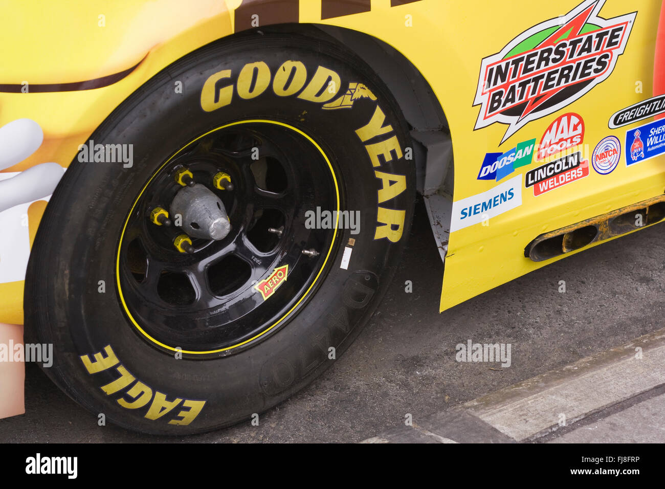 Right Rear Goodyear Eagle D4470 racing tire of a NASCAR Racecar parked on the street Stock Photo