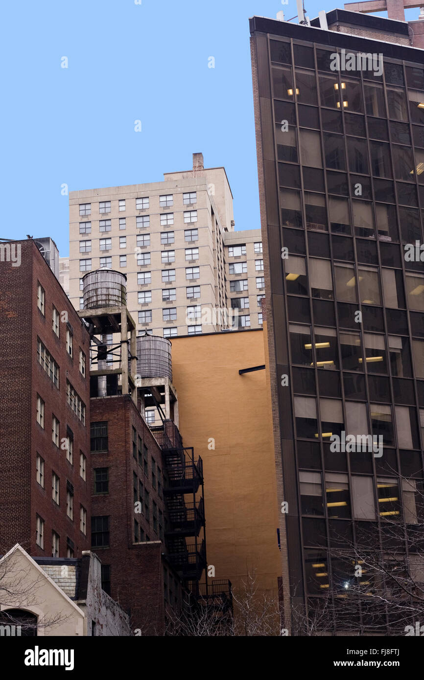 Iconic Wooden Water Towers atop New York City buildings in downtown Manhattan on Broadway and 60th Street Stock Photo