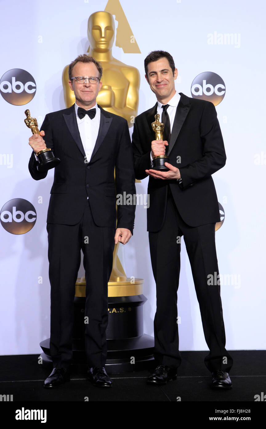 Writers Tom McCarthy (R) and Josh Singer, winners of the Best Writing (Original Screenplay) award for 'Spotlight', pose in the press room during the 88th Annual Academy Awards at Loews Hollywood Hotel on February 28, 2016 in Hollywood, California. Stock Photo