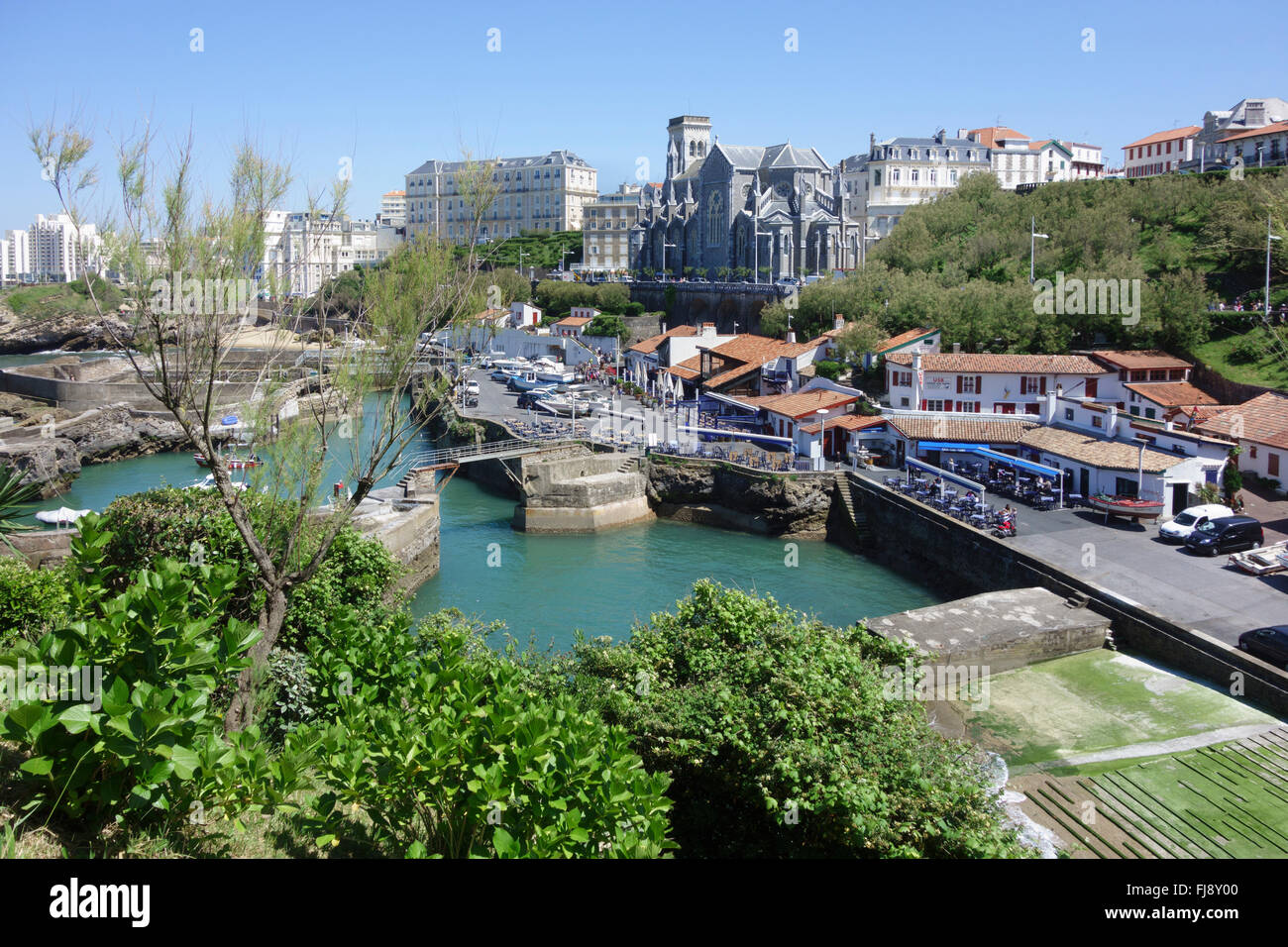 France, Pyrenees Atlantiques, Pays Basque, Biarritz: Fishing harbour or Port Vieux, and the church Sainte Eugenie Stock Photo