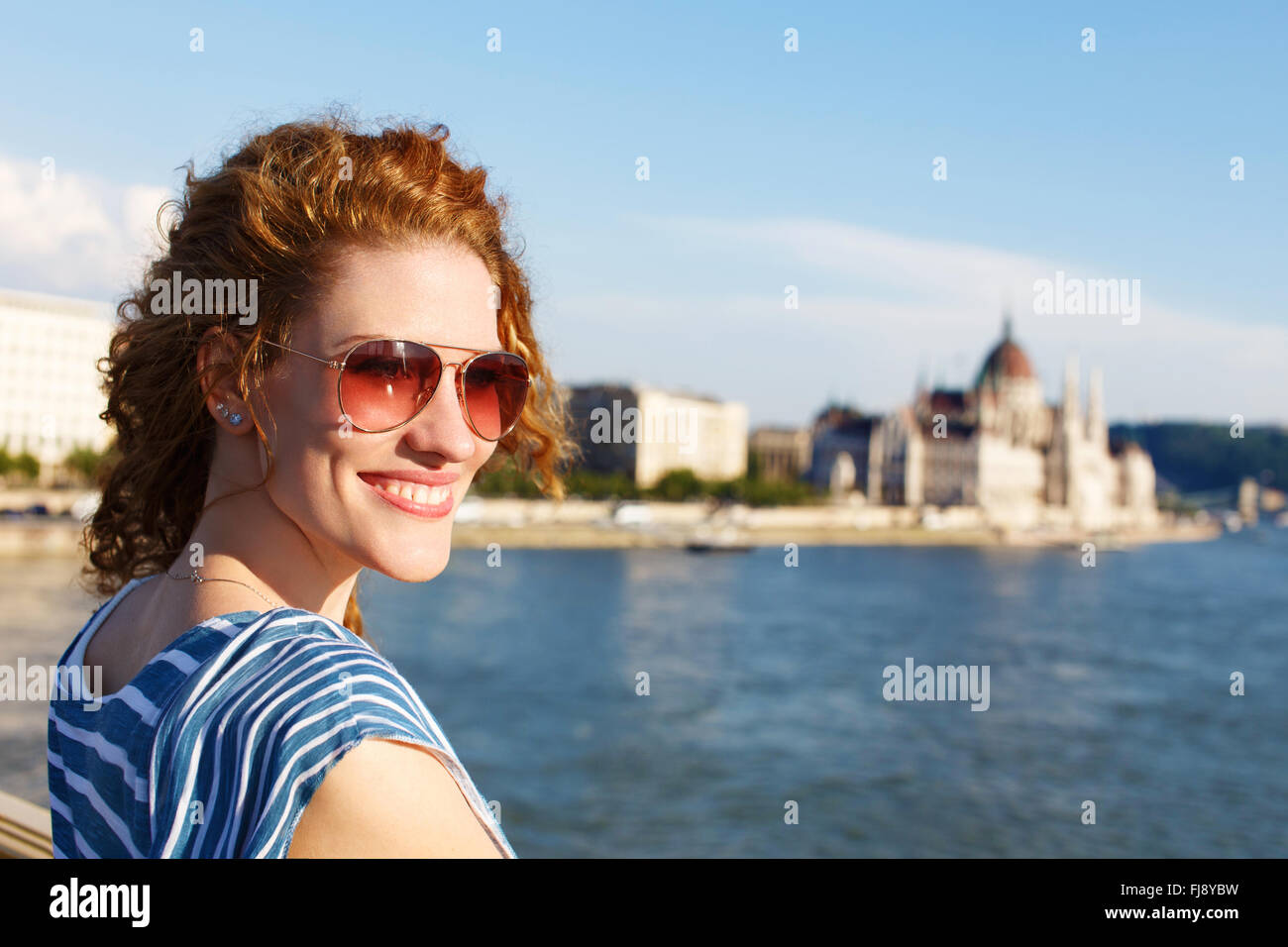 Woman tourist in sunglasses in Budapest, Hungary. Parliament and river Danube background. Stock Photo
