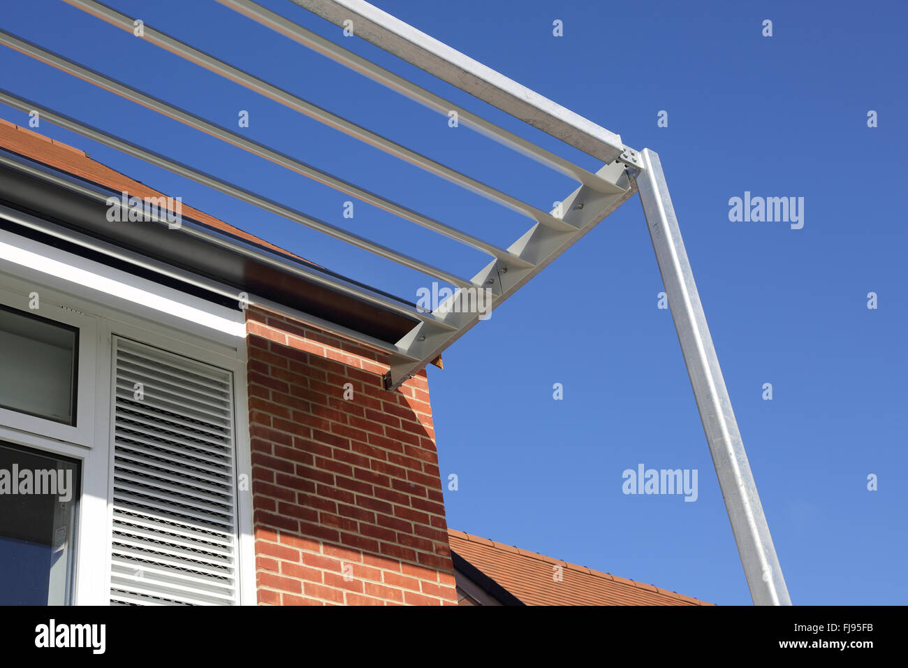 A two-story external steel sunshade structure ( brise soleil ) on a new British primary school Stock Photo