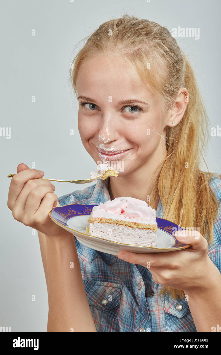 happy woman eating sweet pie Stock Photo Alamy