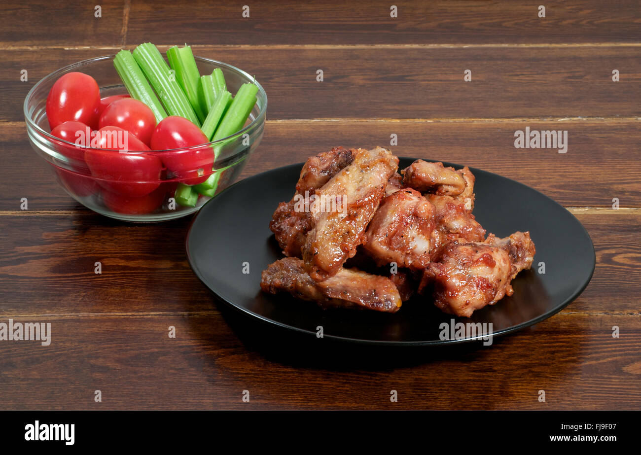 Glazed chicken barbecue wings over wooden background Stock Photo Alamy