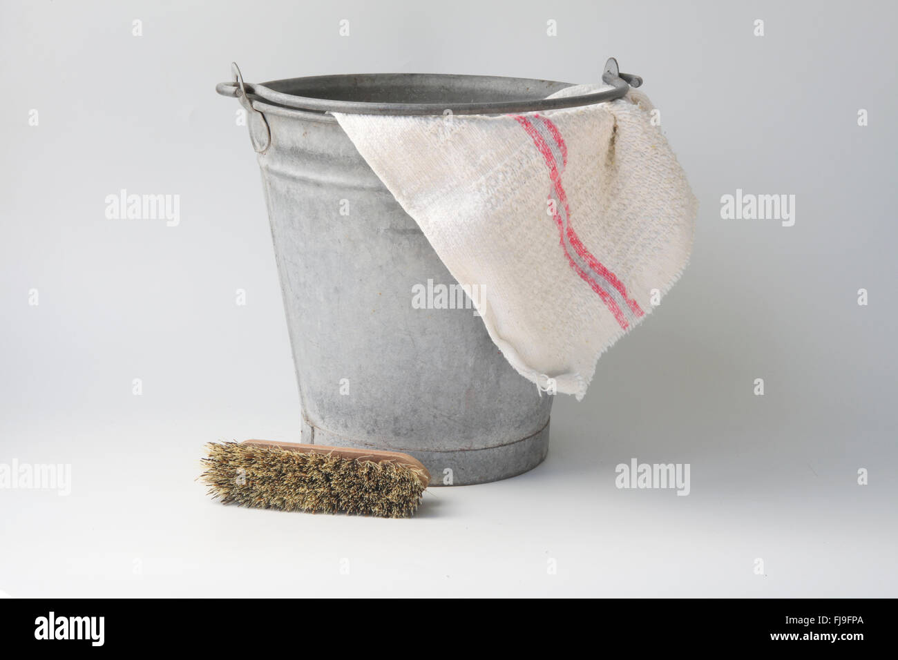 Zinc bucket with cloth and brush Stock Photo