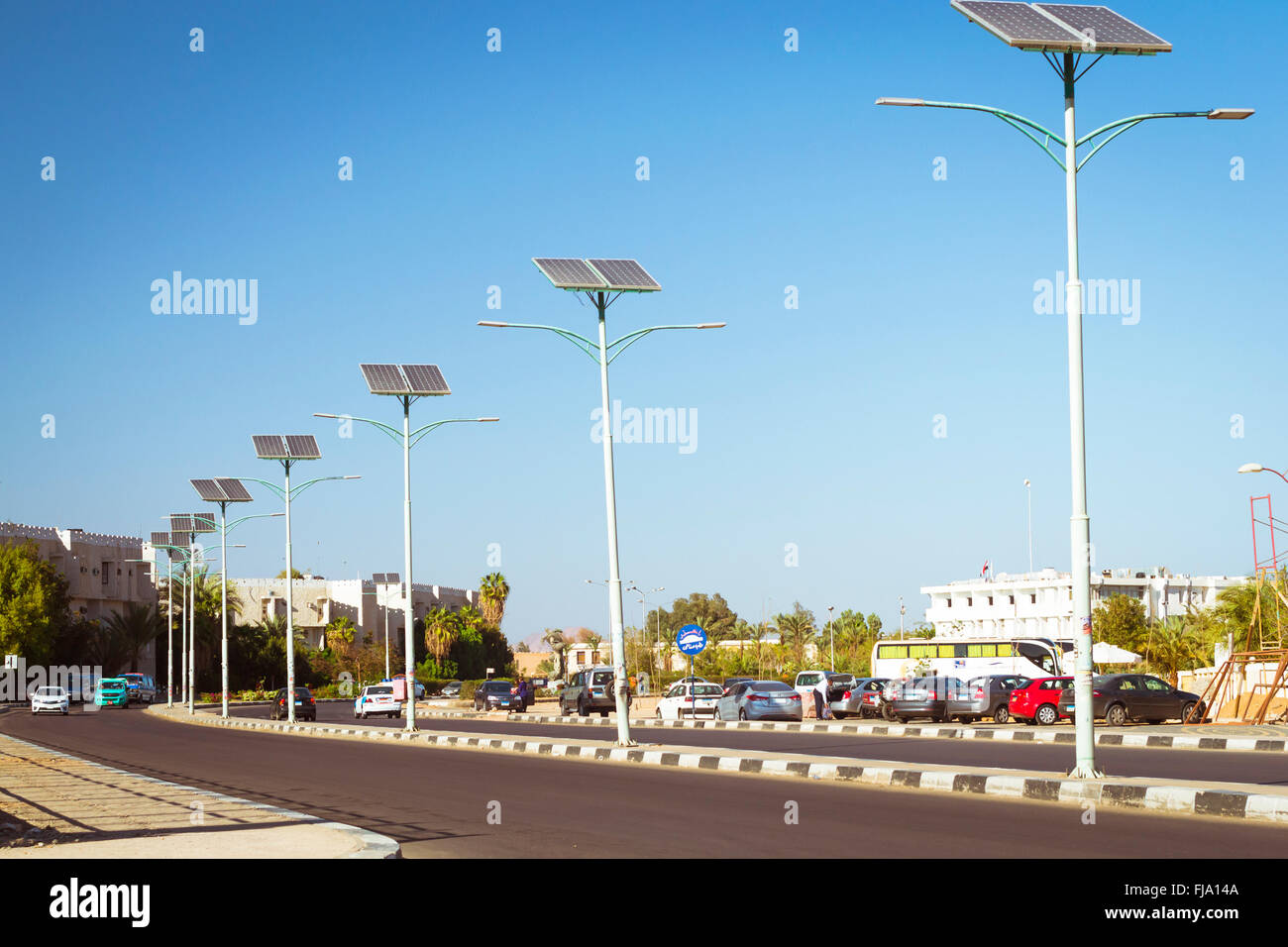 Solar panels on electric pole for lighting on the road in the city, use of solar energy, Sharm El Sheikh, Egypt Stock Photo
