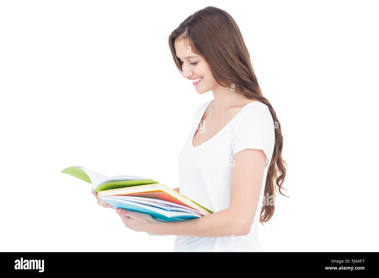 Smiling female college student studying Stock Photo - Alamy