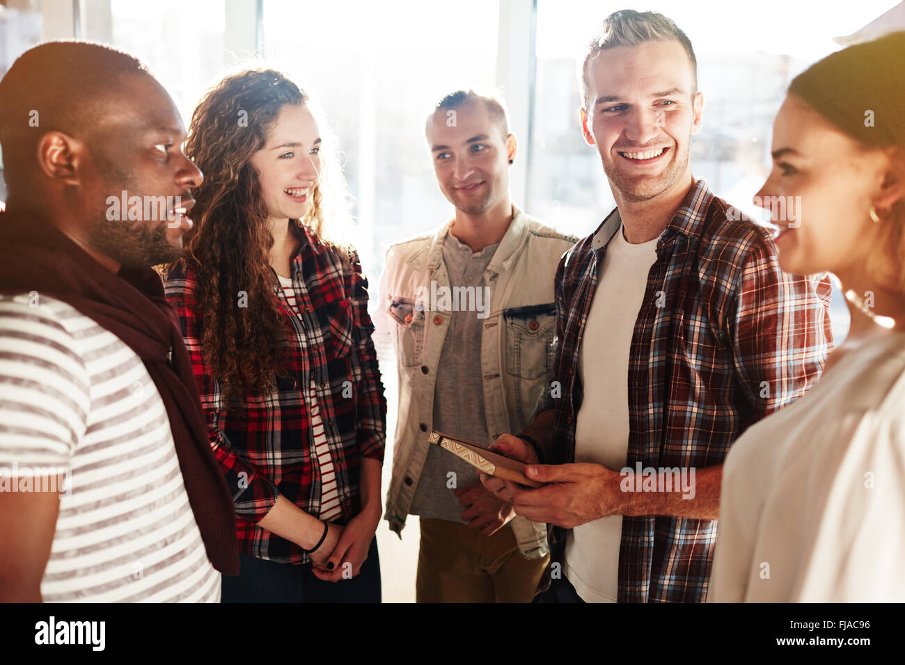 Modern teenagers having talk during break Stock Photo Alamy