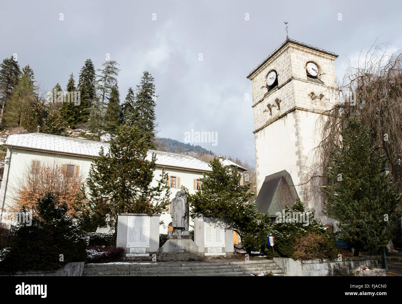 War memorial outside the Church of Our Lady of the Assumption in traditional alpine village of Samoens Rhone-Alpes France Stock Photo