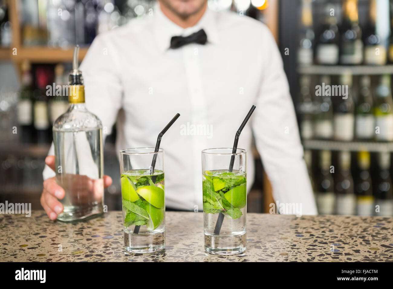 Bar tender making cocktails Stock Photo