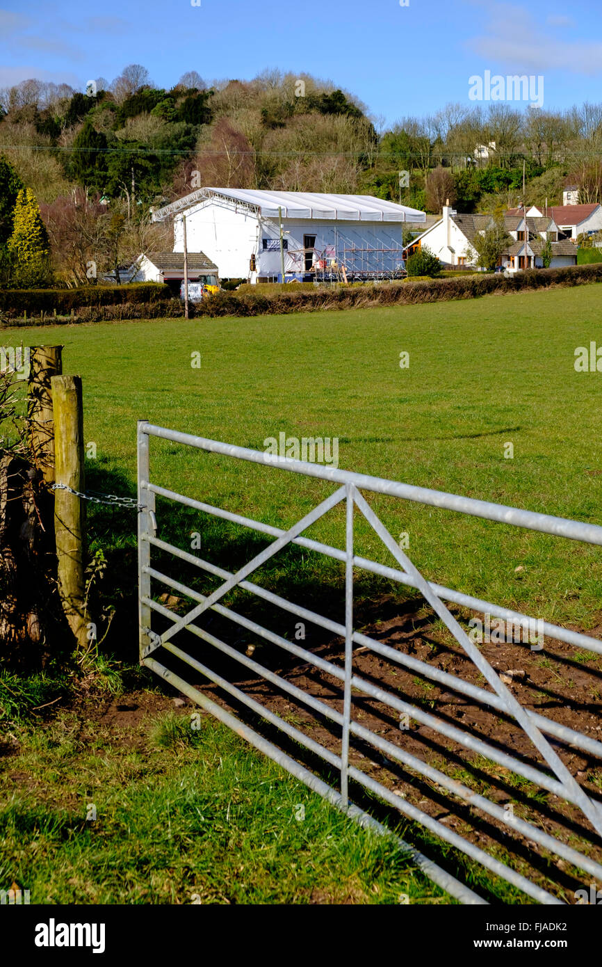 House covered in plastic sheeting while building work is going on