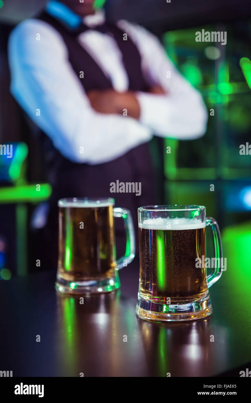 Two glasses of beer on bar counter Stock Photo