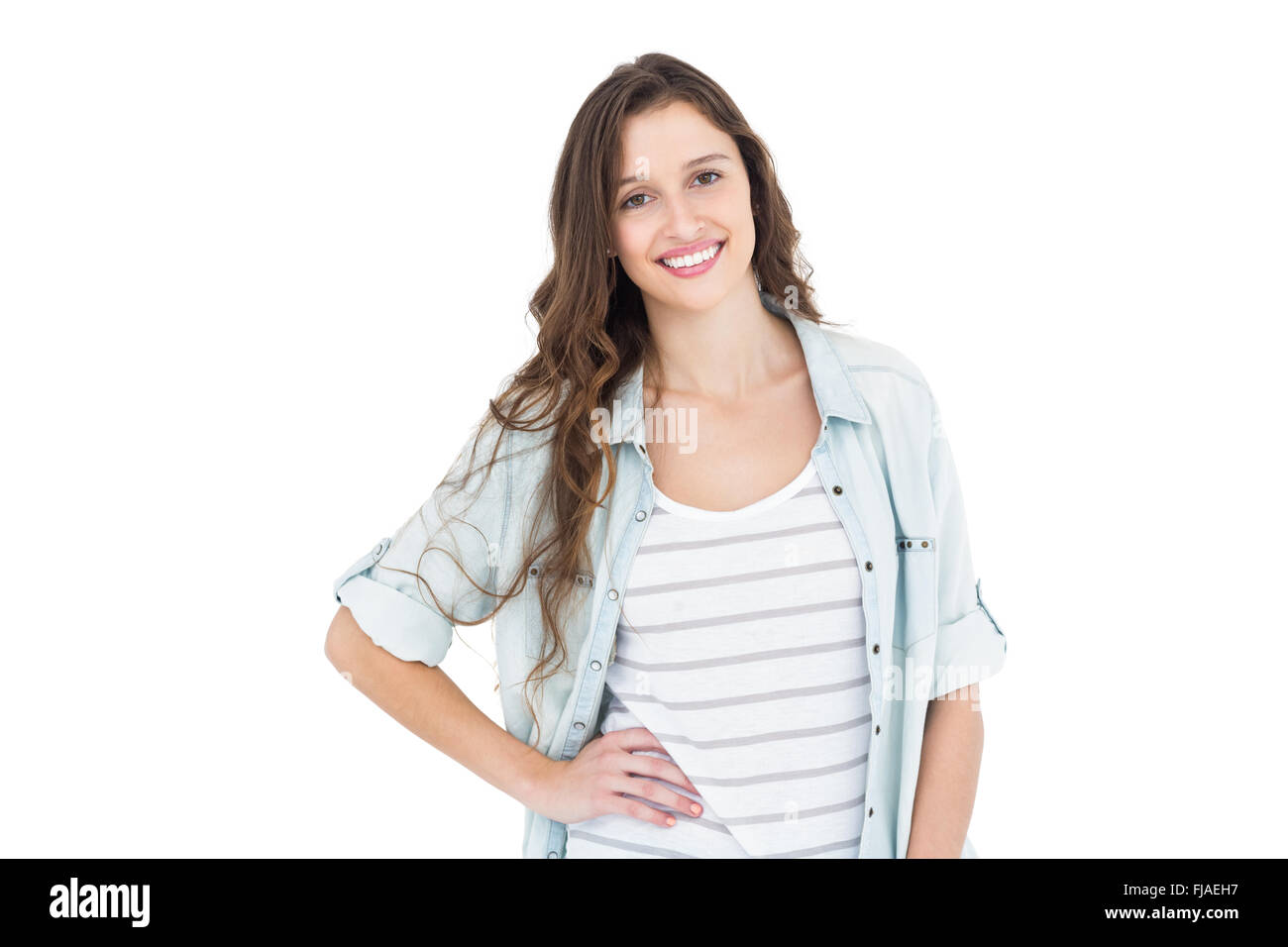 Smiling young woman posing in front of the camera Stock Photo - Alamy