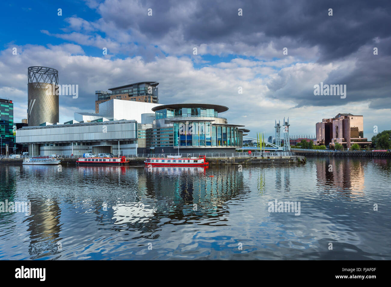 Salford Quays theatre seen across the basin. Stock Photo