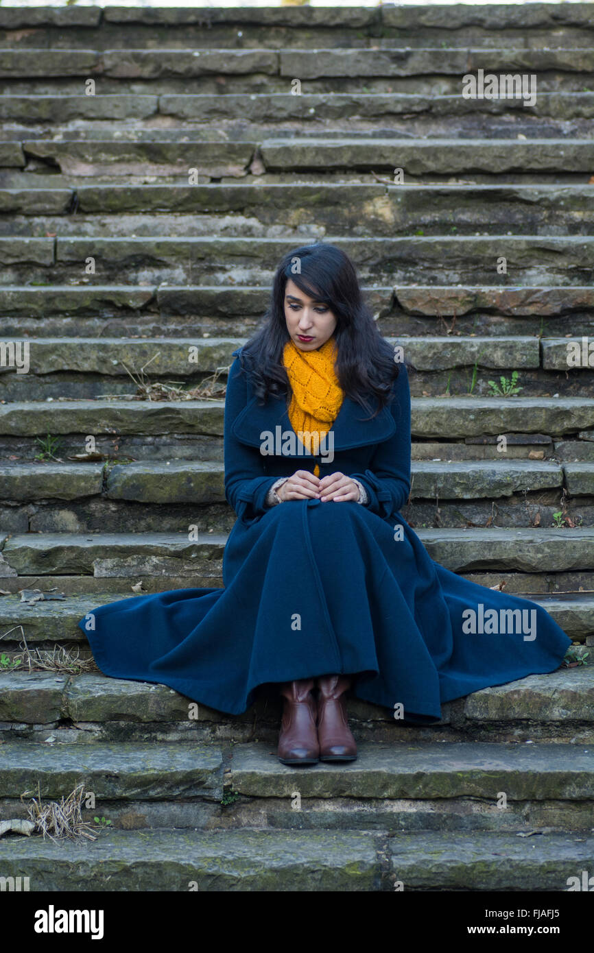 Sad girl sitting on stairs hi-res stock photography and images - Alamy