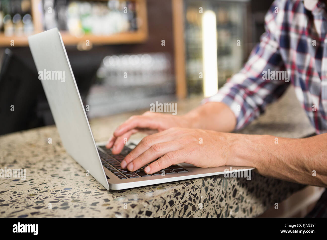 Handsome man using laptop Stock Photo - Alamy