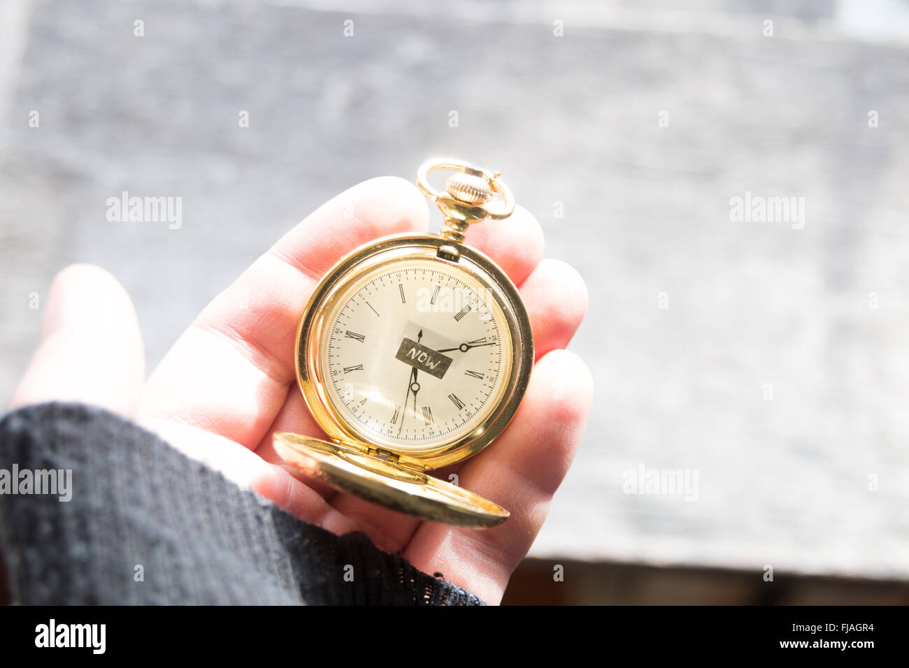 Now, Time concept. Text and pocket watch. Stock Photo