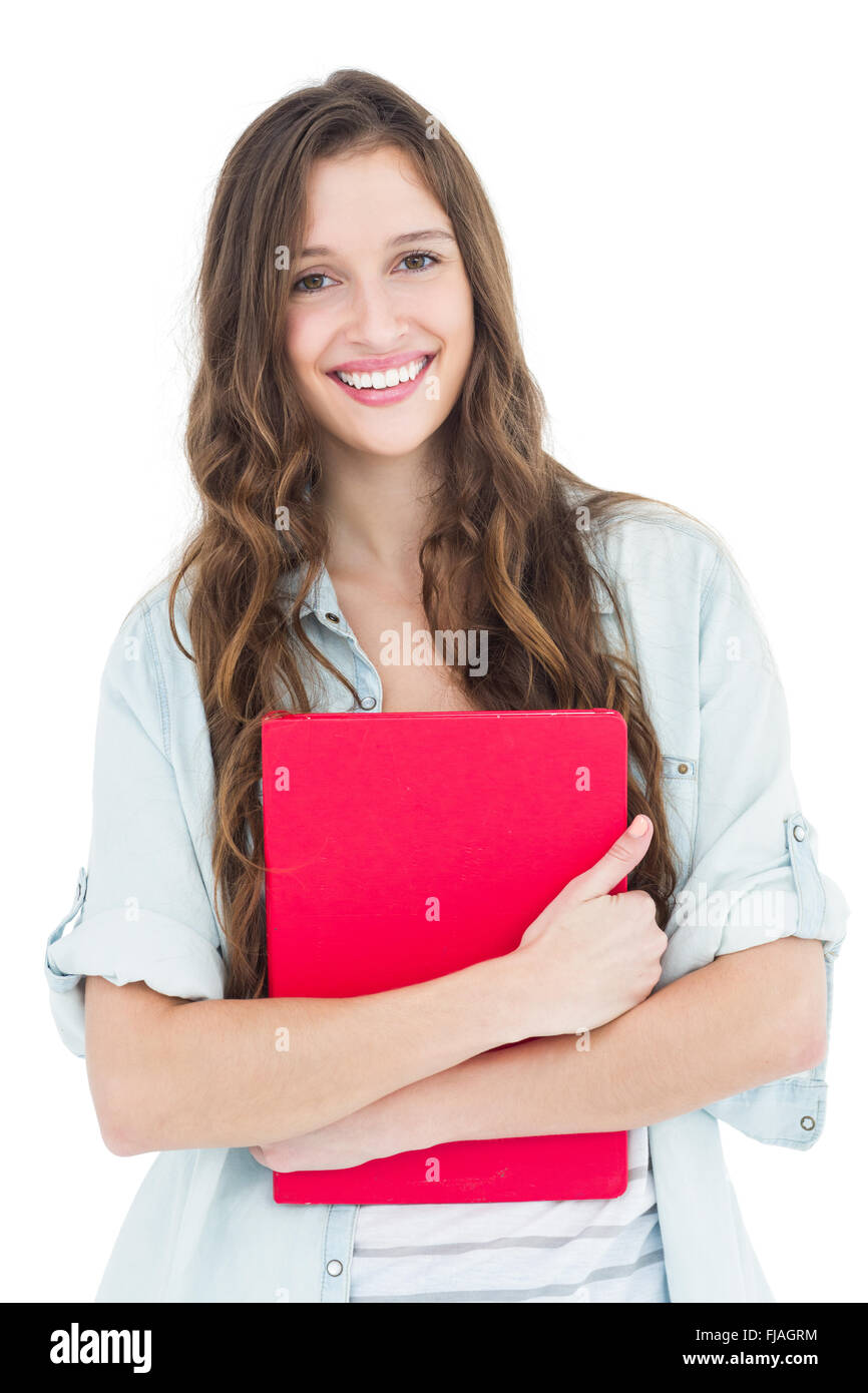 Portrait of female student holding books Stock Photo - Alamy