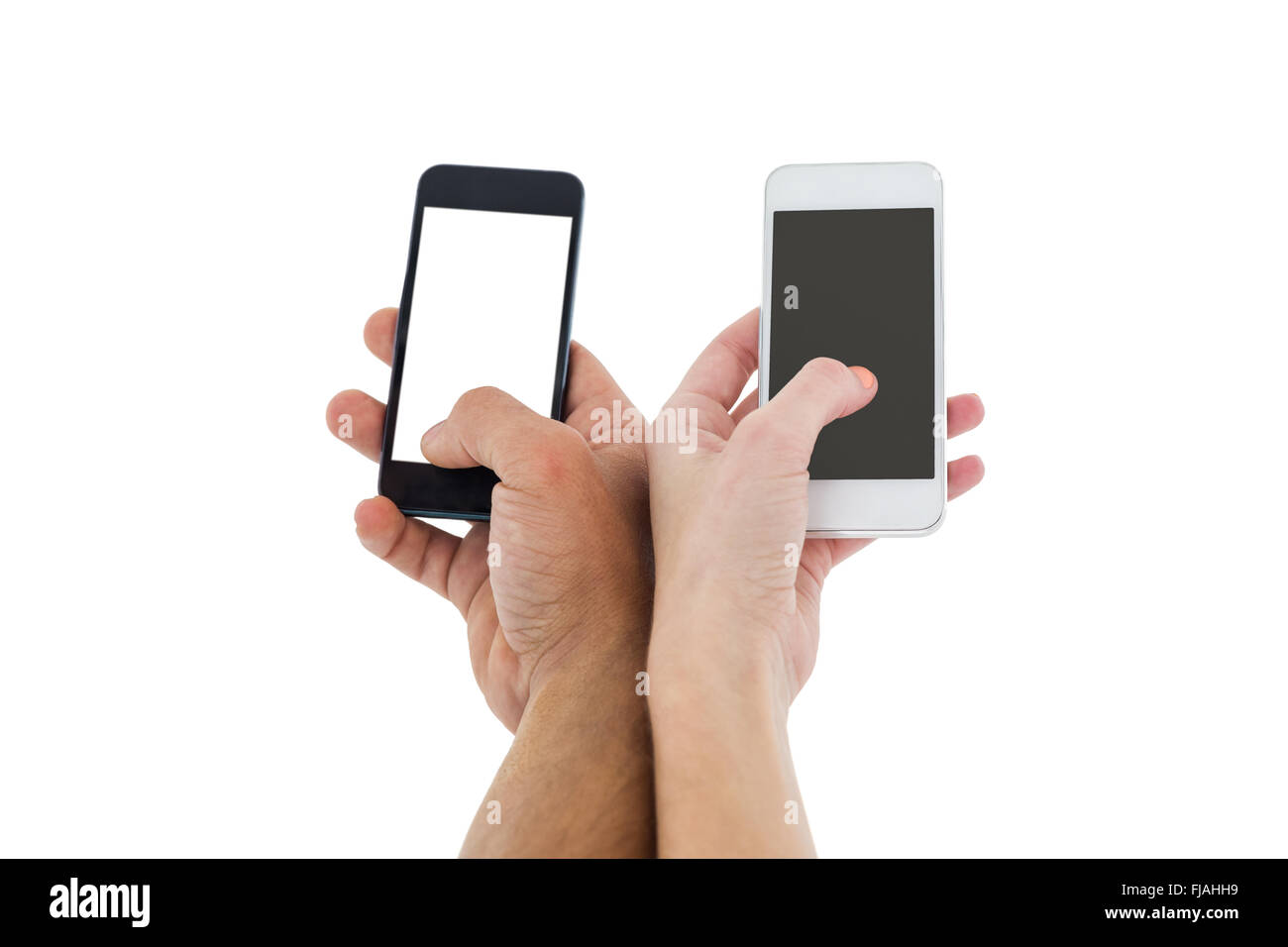 Hands of a couple holding smartphones Stock Photo