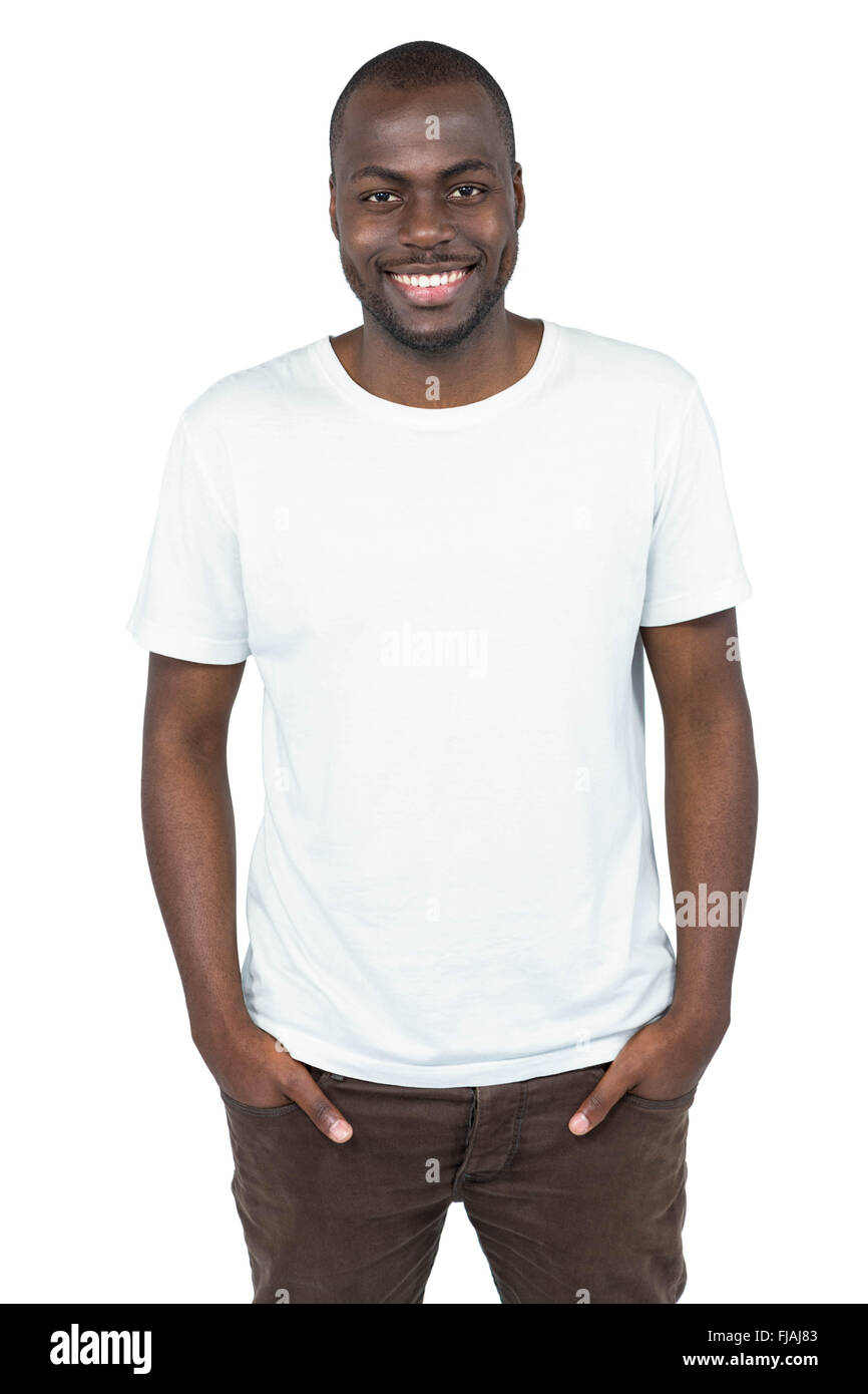 Happy man looking at camera with hands in pocket Stock Photo - Alamy