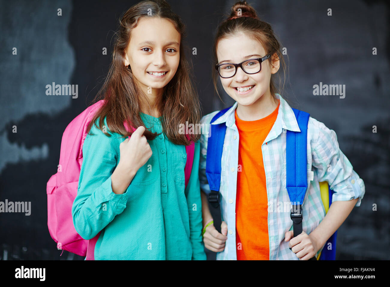 Portrait of two little girls smiling at camera Stock Photo - Alamy