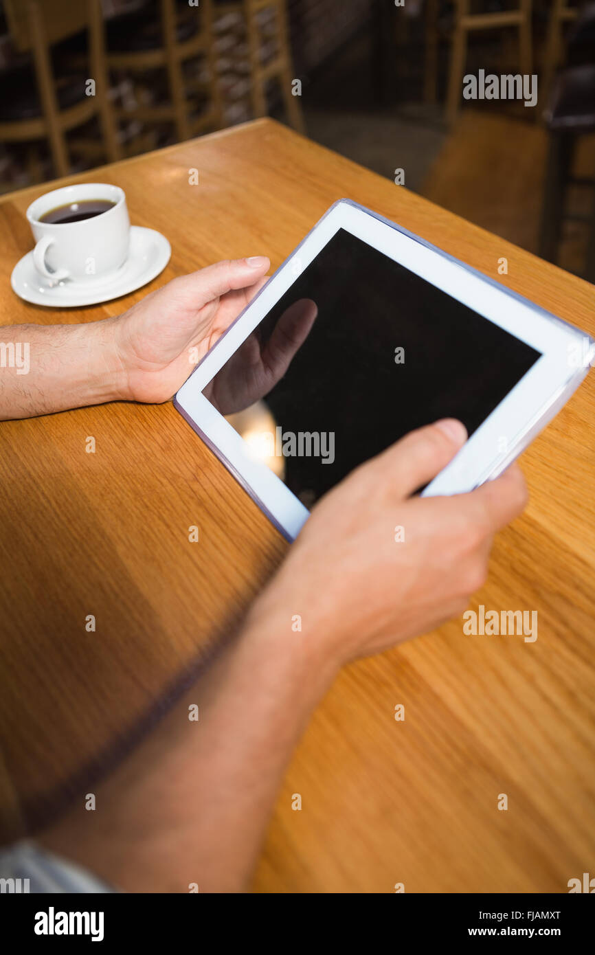 Masculine hands holding tablet Stock Photo