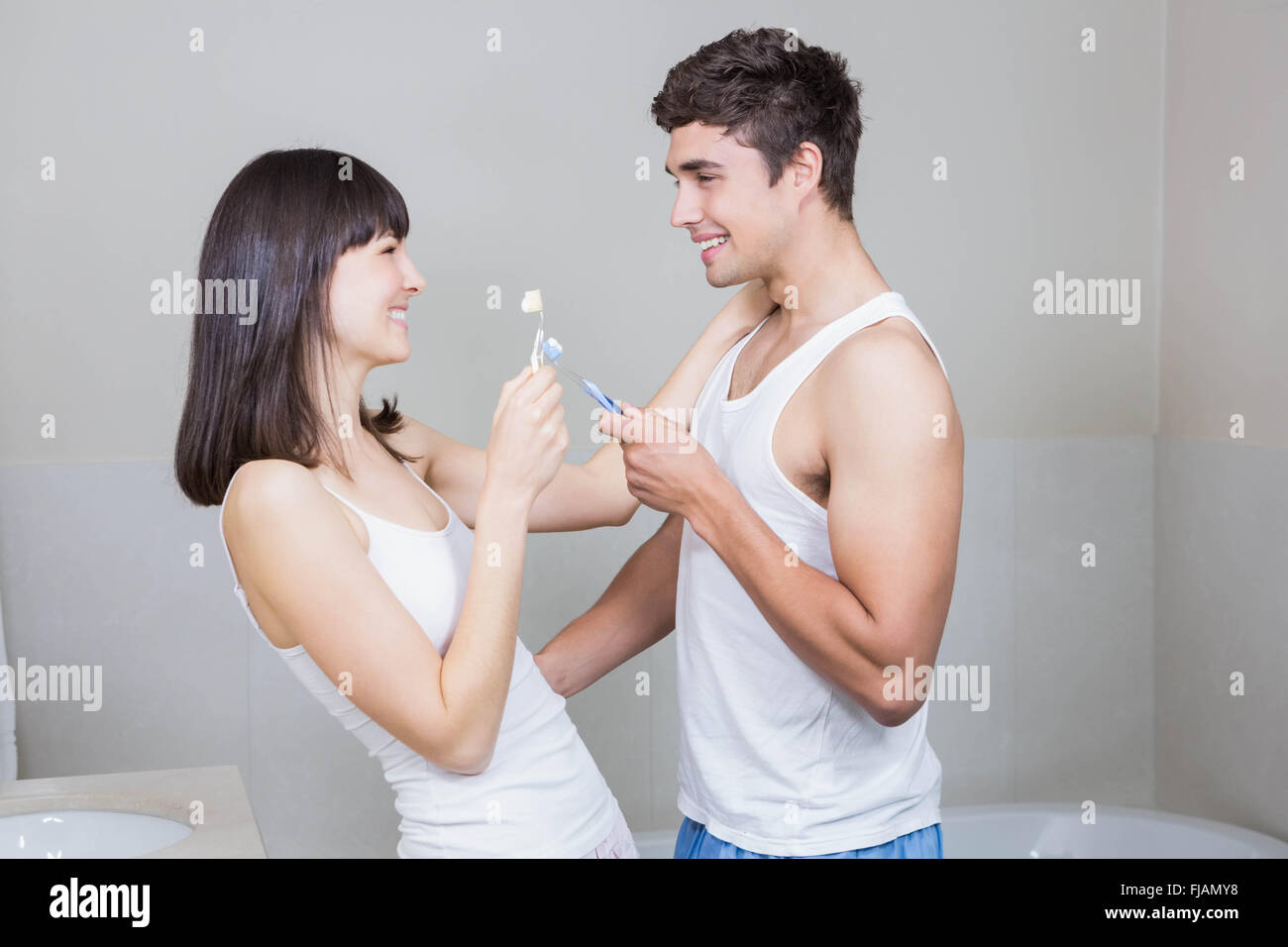 Bathroom routine for happy young couple Stock Photo