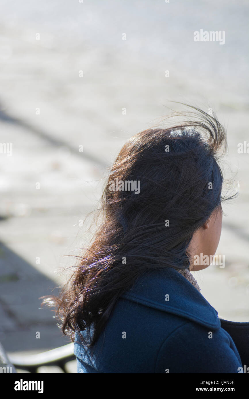 Rear view of a young woman outdoors Stock Photo