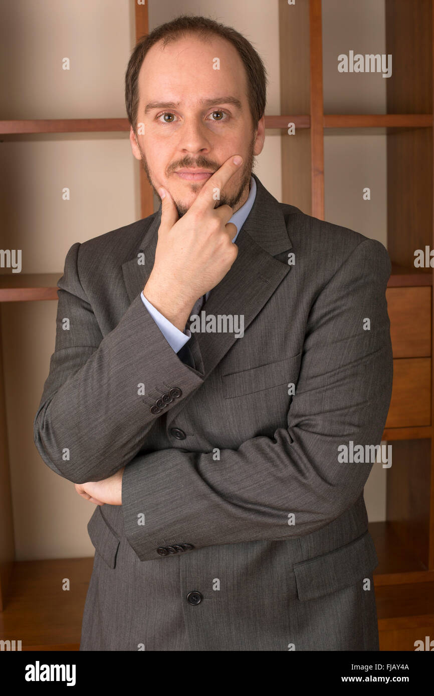 business man in home office with thoughtful look Stock Photo - Alamy