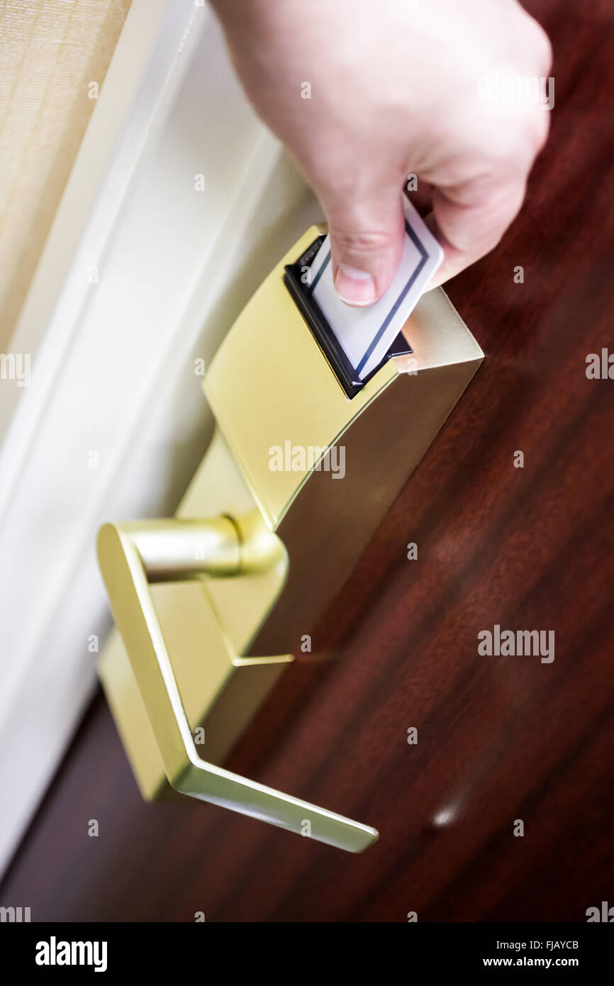 Unlocking Door With Key Card Stock Photos Unlocking Door