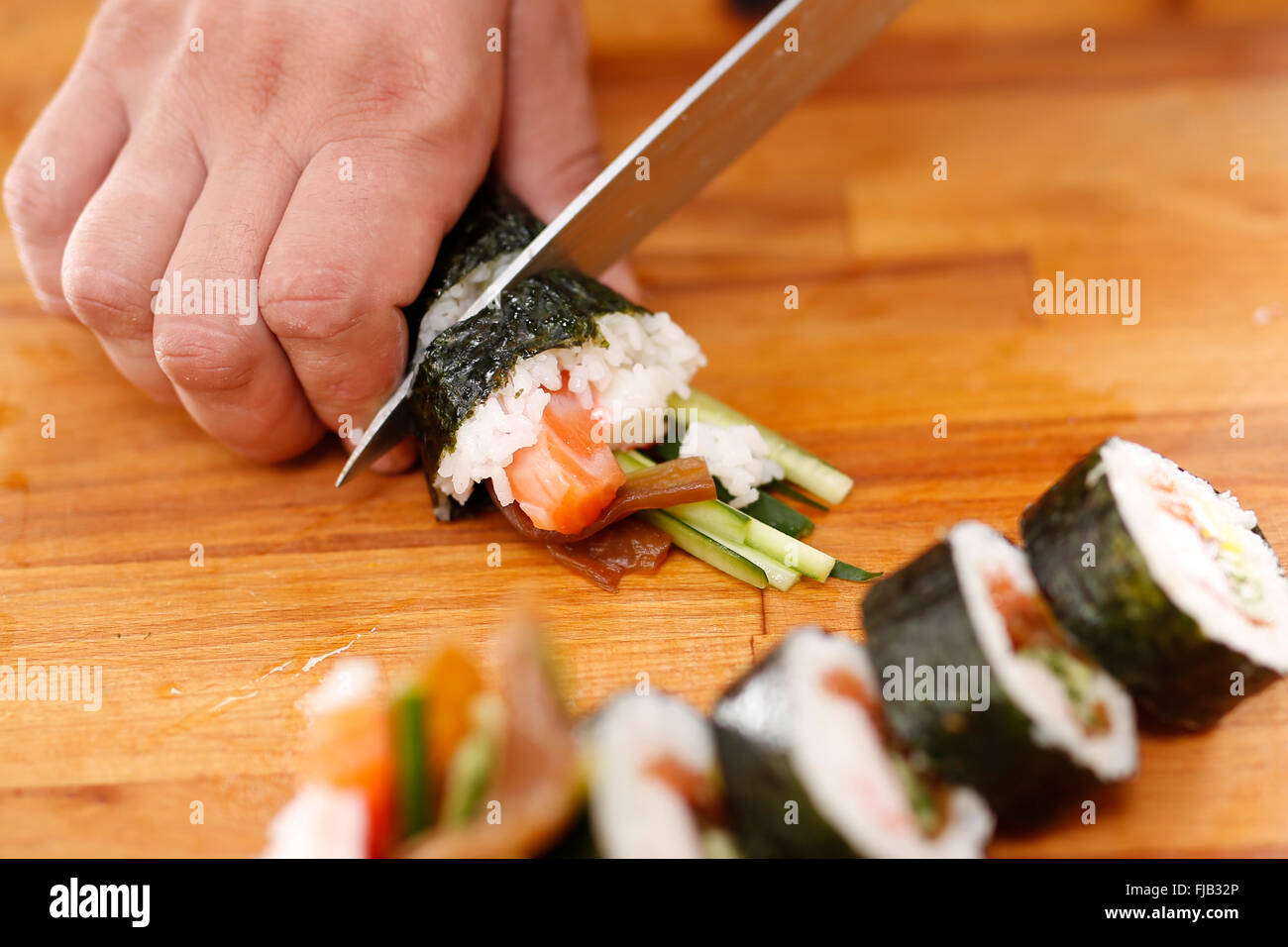 Classic Japanese sushi . Sushi. Smoked salmon nigiri sushi.Japanese cuisine, sushi. Sushi menu.Sushi master preparing sushi . Stock Photo