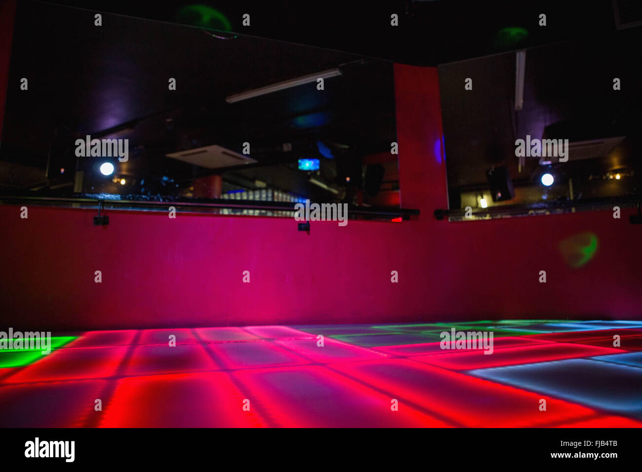 Red illuminated disco dance floor Stock Photo