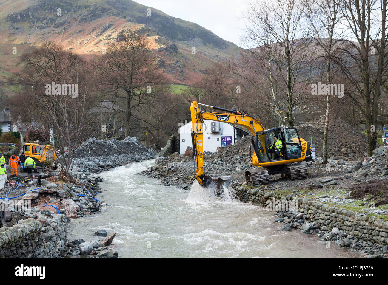 Diggers Dredging Glenridding Beck in the Aftermath of Storm Desmond Lake District Cumbria Stock Photo