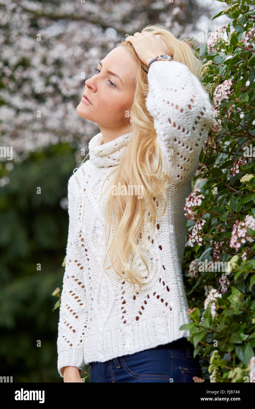 Woman outdoors looking sad Stock Photo