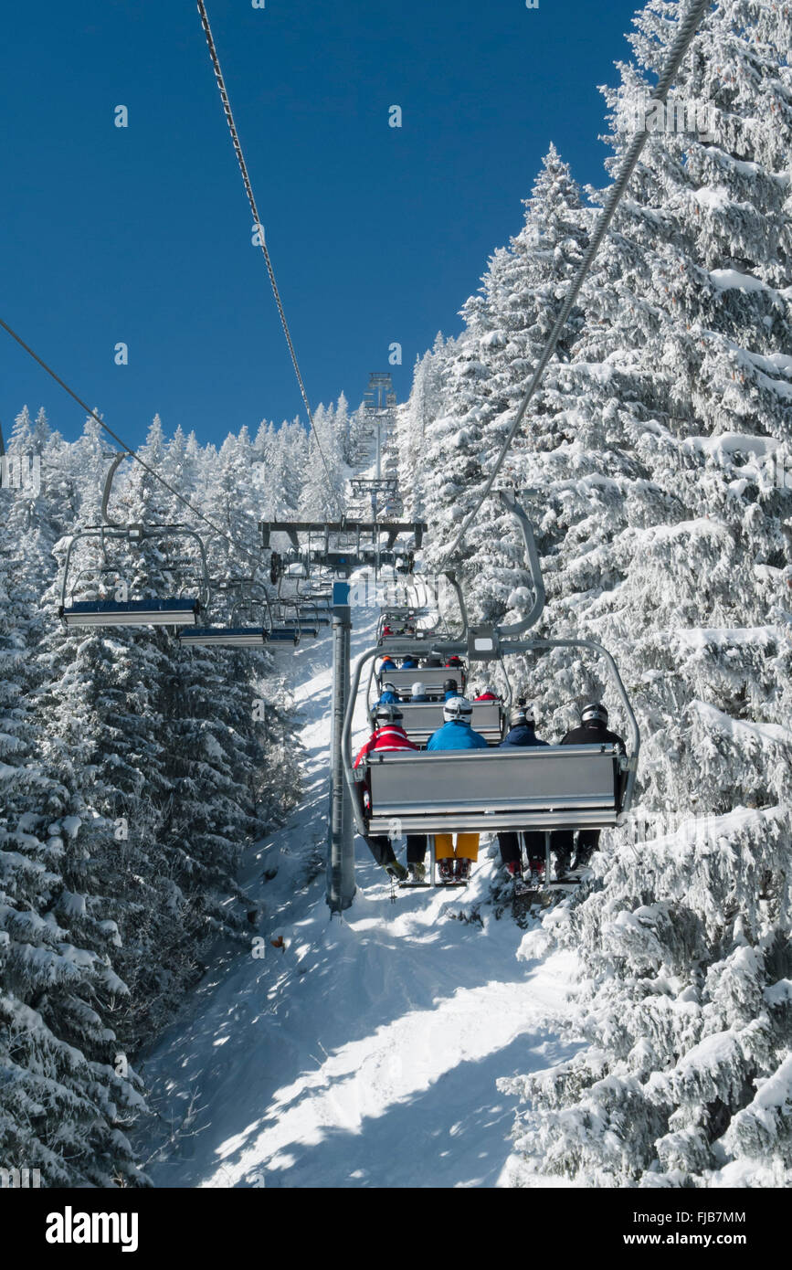 On a ride on a chairlift in the Brauneck ski resort in Lenggries, Bavaria, Germany Stock Photo